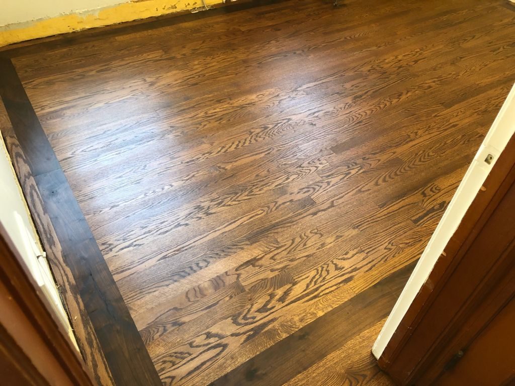 Aacer red oak with 5" walnut border finished with Bona Craft Oil