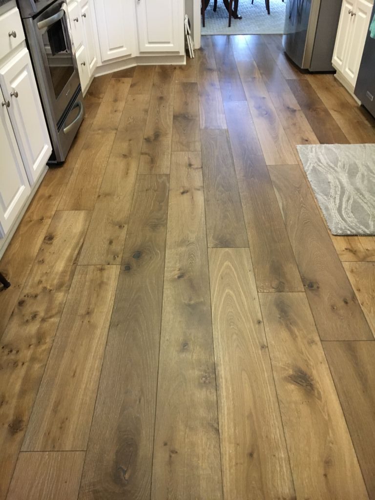 Close-up of wide plank European White Oak Palladio floor installed in kitchen