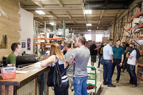 Employees and customers hang out during grand opening