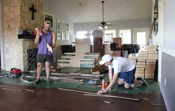 Employees installing new floor